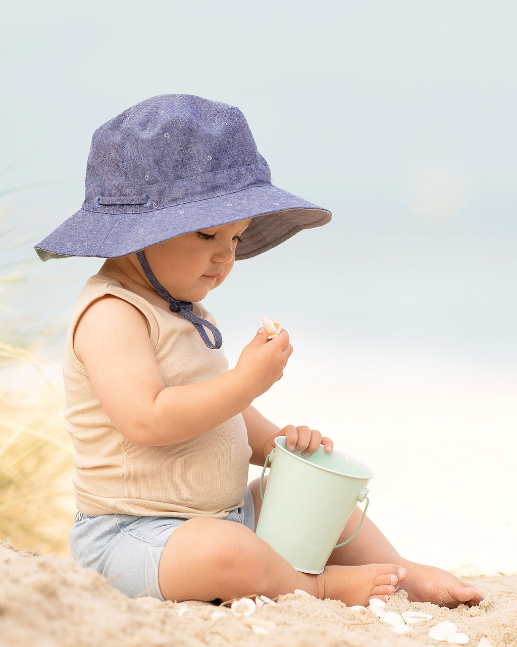 Toshi Sunhat Xavier /ink [sz:s]