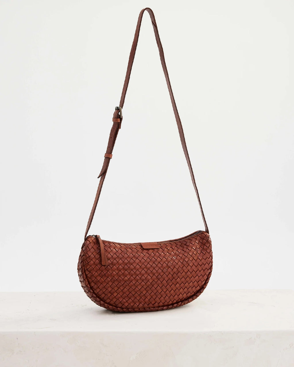 Juju & Co Basque Woven Sling Bag Amber